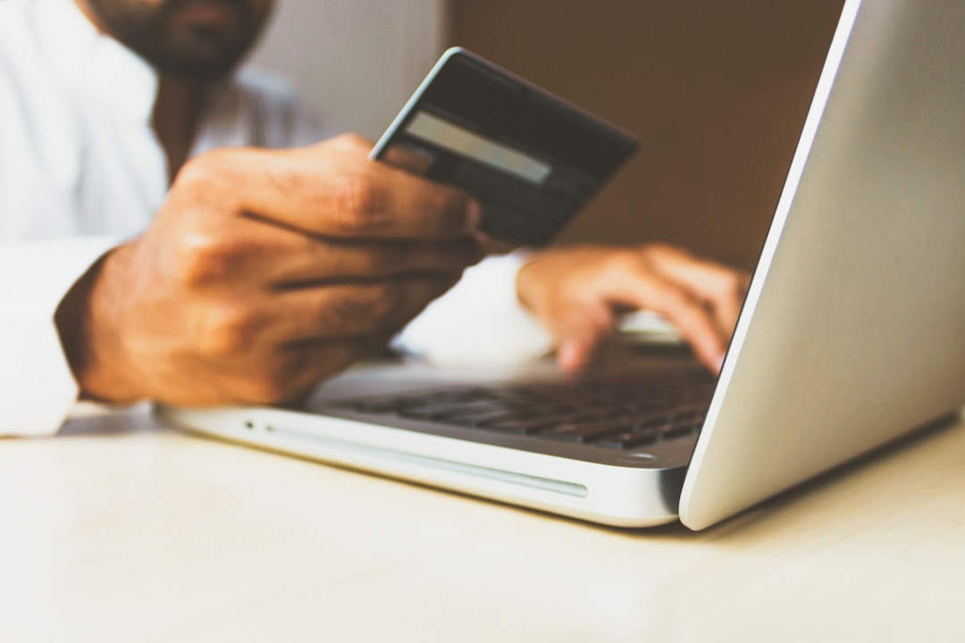 Consumer purchasing online with credit card to represent sales acceleration for ABS